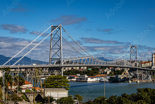 Sunny day view of the Hercilio Luz suspension bridge. The longest suspension bridge in Brazil and the symbol of the city of Florianopolis. Design engineering structure bridge. Bridge structures © Александр М.