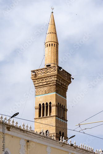 Low angle view of the EL Atik mosque minaret in Setif city.  photo