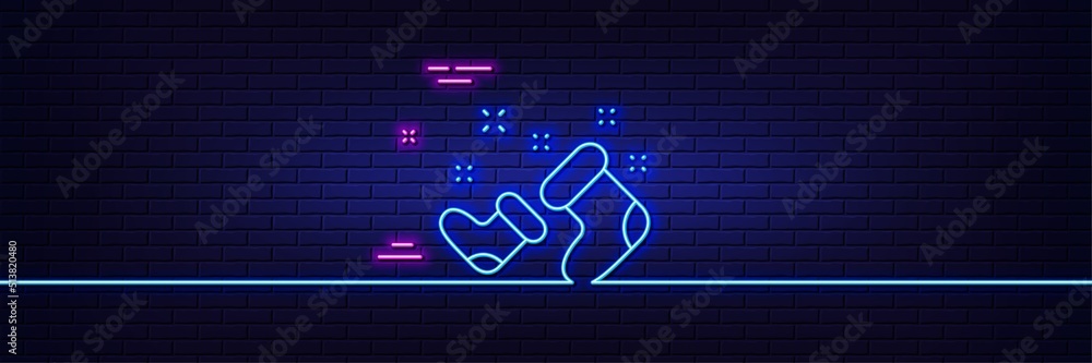 Neon light glow effect. Santa boots line icon. Christmas or New year sign. Claus symbol. 3d line neon glow icon. Brick wall banner. Santa boots outline. Vector Neon light glow effect. Santa boots line icon. Christmas or New year sign. Claus symbol. 3d line neon glow icon. Brick wall banner. Santa boots outline. Vector
