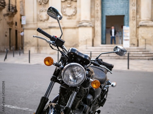 Obraz na płótnie Headlamp of historical motorcycle in front of a church in Lecce, Italy w salonie