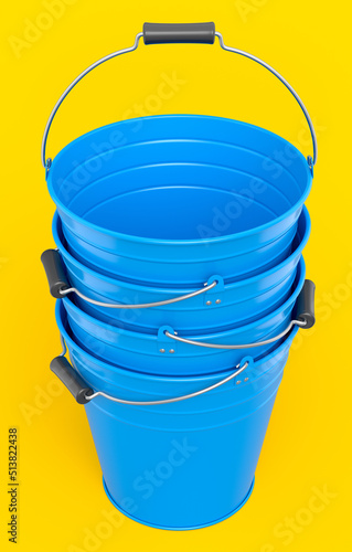 Set of metal garden buckets for hydration of plants isolated on yellow