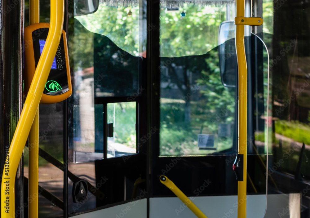 Terminal for contactless fare payment in public transport in interior of the bus Terminal for contactless fare payment in public transport in interior of the bus
