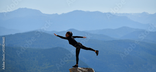 Woman Practicing Yoga in Spectacular Landscape photo