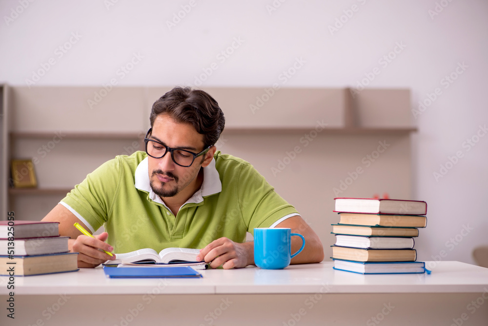 Young male student studying at home Young male student studying at home