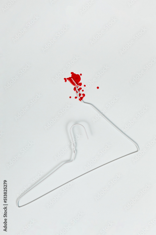 Bloody Wire Coat Hanger Reminder Of Unsafe Abortion Stock Photo