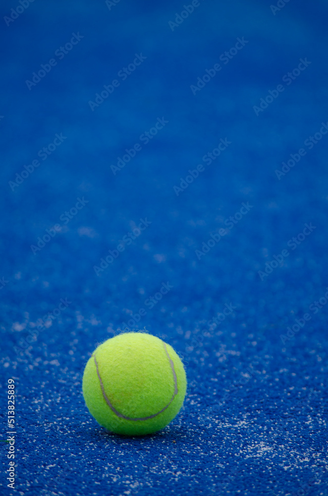selective focus, one ball on a blue paddle tennis court