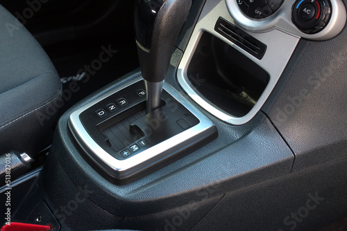 Automatic transmission gearshift stick, Closeup a manual shift of modern car gear shifter. Close up of the automatic gearbox lever, black interior car. © Best Auto Photo