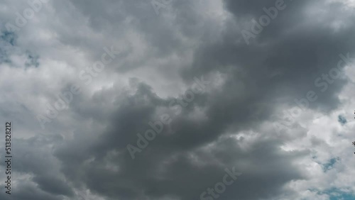 Dramatic clouds move fast in dark stormy sky in rain season. environment in wet weather clouds thunderstorm climate change. timelapse 4k of rolling clouds. panoramic gray cloudy sky photo
