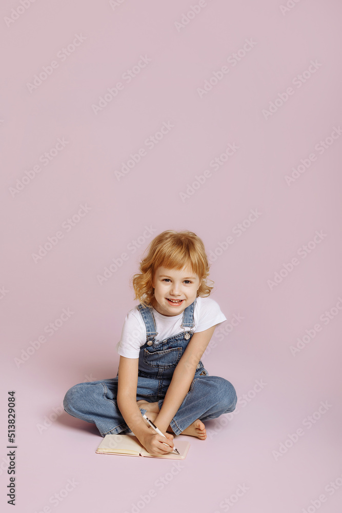 Cute long haired girl in denim overalls. Cute long haired girl in denim overalls.