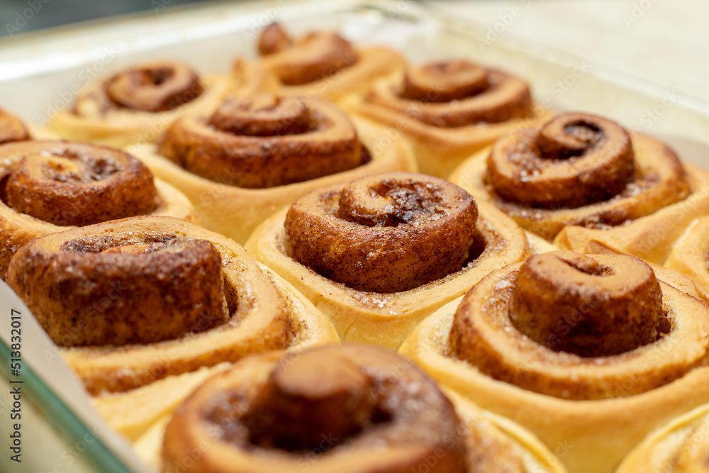 Homemade sweet cinnamon rolls. Close Up of freshly cooked buns. Homemade sweet cinnamon rolls. Close Up of freshly cooked buns.