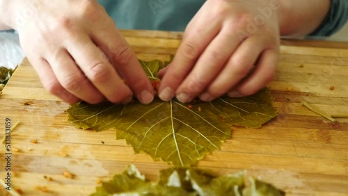 Stuffed grape leaves typical of Turkey, a housewife making stuffed leaves