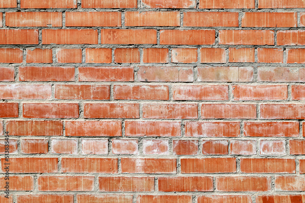 Obraz premium An old damaged brick wall as a background