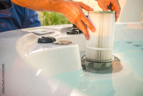 Bild auf Leinwand Hot Tub Technician Removing Water Filter and Performing Scheduled Garden SPA Mai