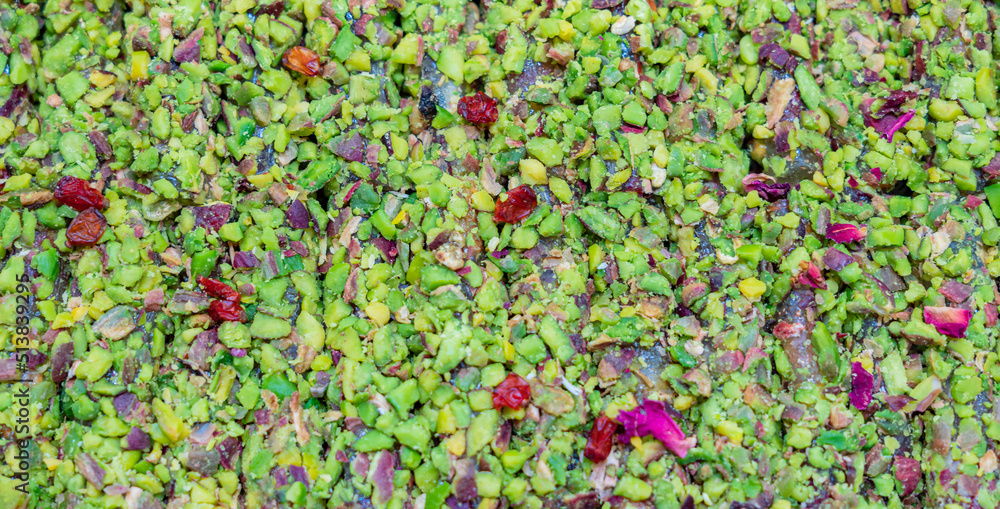 crushed pilled pistachios close up colored background crushed pilled pistachios close up colored background