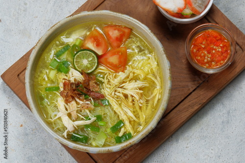 Soto ayam is a typical indonesian food in the form of a kind of chicken soup with a yellowish sauce 