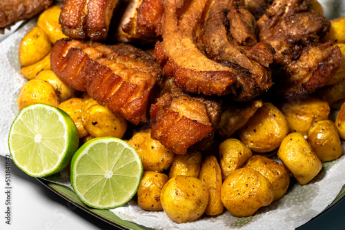 Plato picada de carne con chicharron fritanga colombiana photo