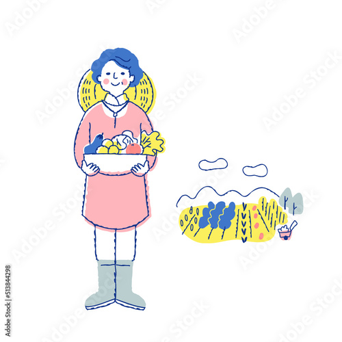 収穫物を持っている野菜農家の女性と畑