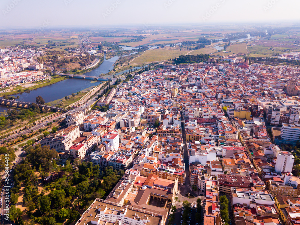 View from drone of Spanish city of Badajoz on both sides of Guadiana river on sunny spring day