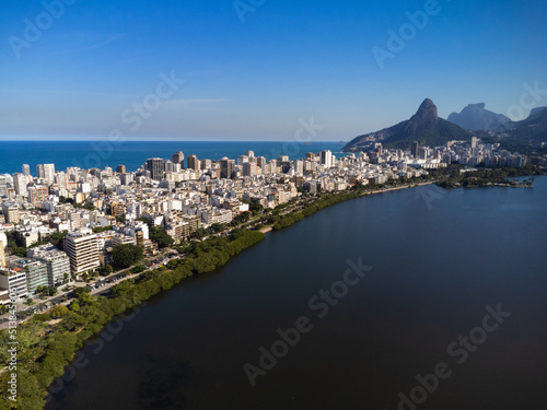 Aerial view of Rodrigo de Freitas Lagoon, south zone of Rio de Janeiro, Brazil. In the background, the beaches of Ipanema and Leblon and Morro Dois Irmãos. Sunny day. Buildings around. Drone photo photo