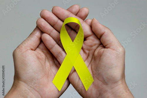 Yellow ribbon. Yellow July, Bone Cancer Awareness Month and Viral Hepatitis