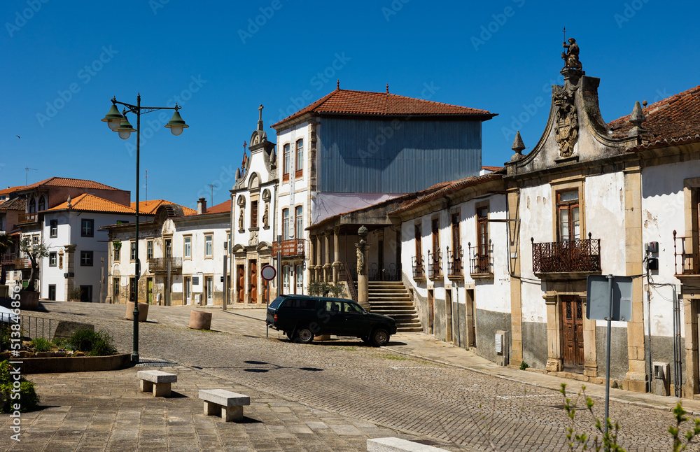 Streets of Mirandela in afternoon. Old streets of Portuguese city under clear sky.