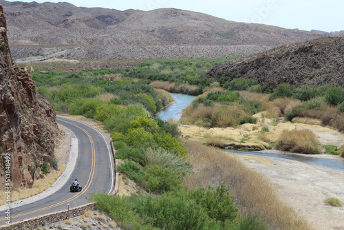 Three wheeled motorcycle along the Rio Grande River at Big Bend Ranch State Park in Texas photo