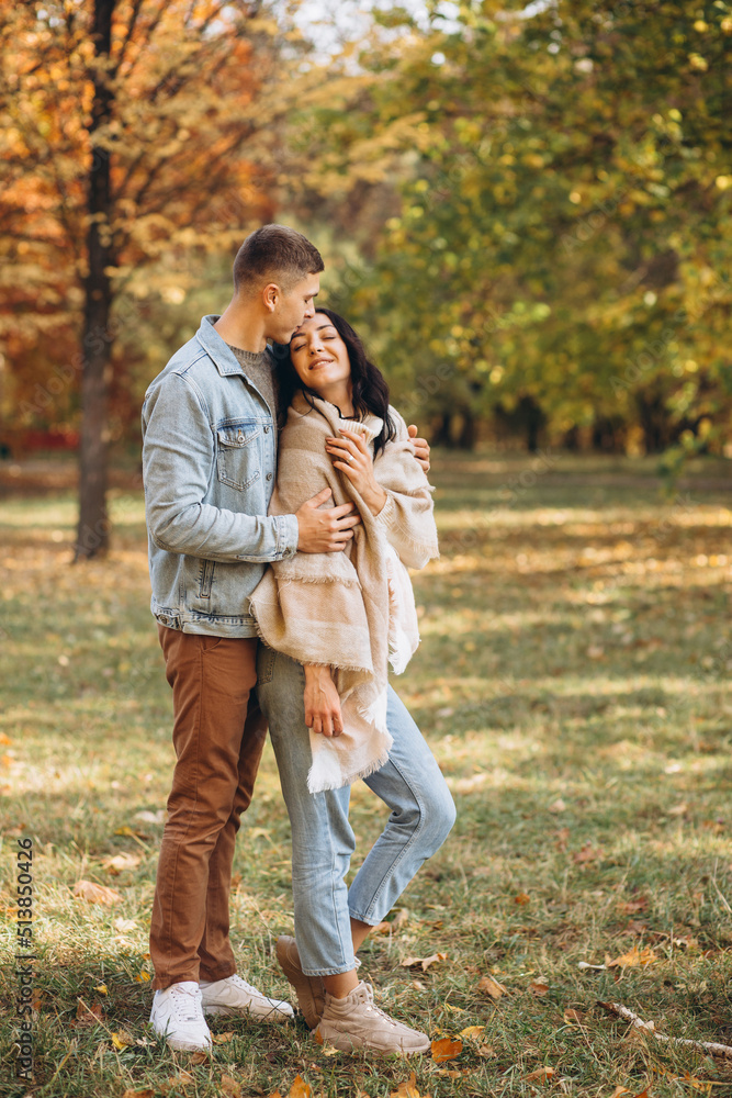 Fototapeta premium Happy couple together in the autumn park
