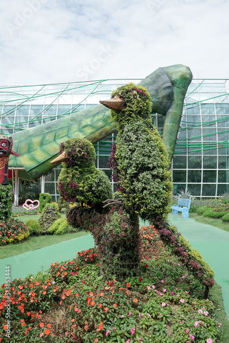 Green sculptures topiary garden created from artificial grass - gardens topiary. Creative idea for landscape design.  photo
