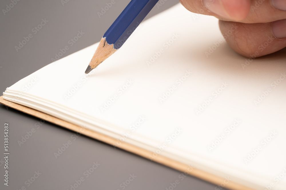 hand writing on the paper on desk office. hand writing on the paper on desk office.