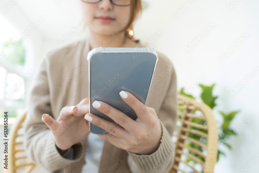Close up of woman using mobile phone.
