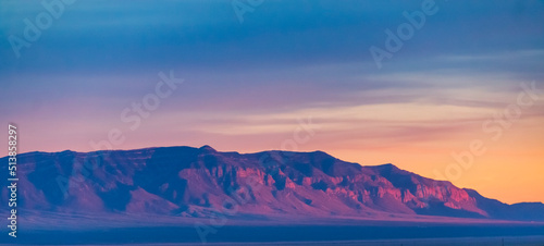 Fiery sunset illuminating the rocky mountains in New Mexico