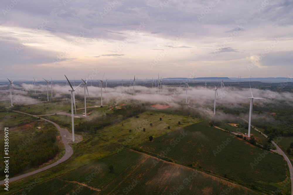 Aerial view of wind turbine sunset. Sustainable development, environment friendly, renewable energy concept.