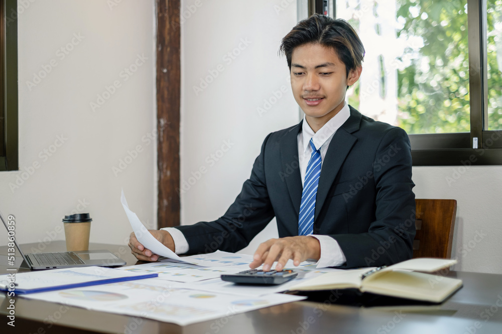 Businessman or financial market analysts work and calculate financial graphs that show investment results planning the process of successful business growth Businessman or financial market analysts work and calculate financial graphs that show investment results planning the process of successful business growth