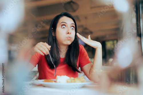 Fototapeta Greedy Hungry Customer Eating a too Hot Meal in a Restaurant - Funny woman hurti