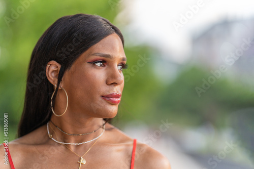 Portrait of a distracted transsexual woman outdoors