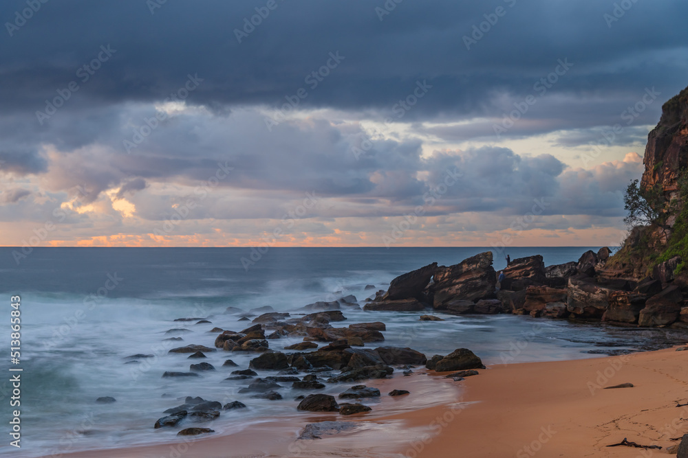 Dawn seascape with rain clouds