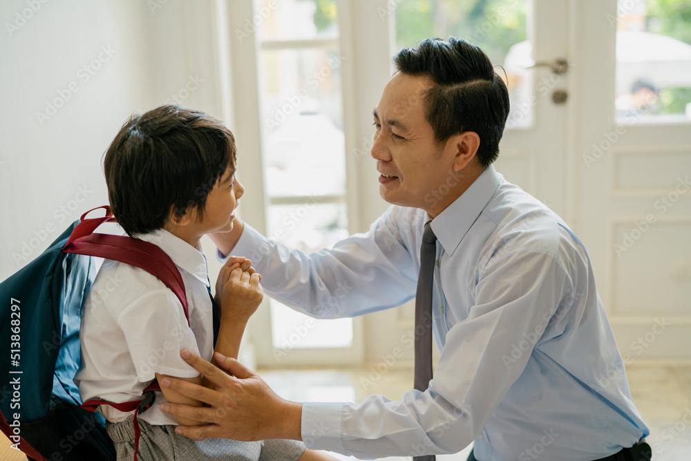 Father teasing his son before going to school Father teasing his son before going to school