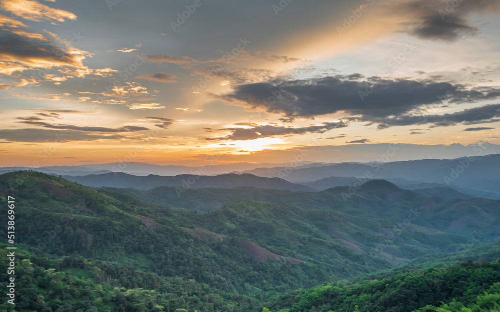 Colorful sunset over the mountain hills Thailand.