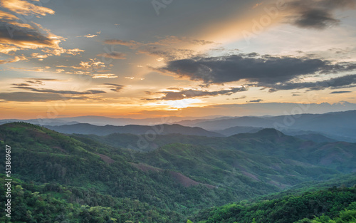 Colorful sunset over the mountain hills Thailand. © Anurak