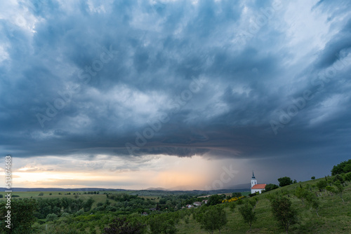 Stormy landscape with small chapel