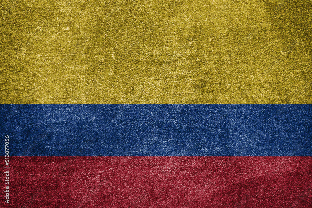 Old leather shabby background in colors of national flag. Colombia