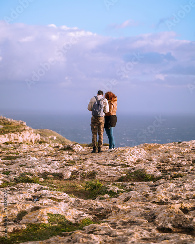 travel couple by the ocean