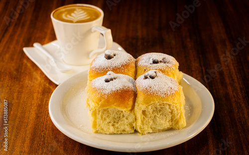 sweet bread stuffed with chocolate and a cup of coffee