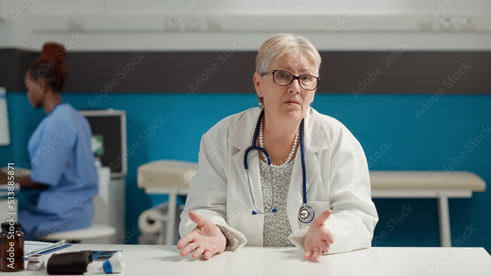 Obraz premium POV of doctor meeting with patient on video call conference, using webcam videoconference to gvie advice on internet telecommunication call. Online remote telehealth and telemedicine chat.
