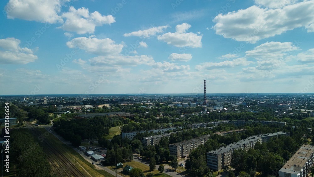 Tranquil suburbs in a big city. Multi-storey buildings and a large green area. Panoramic photo. Aerial photography.