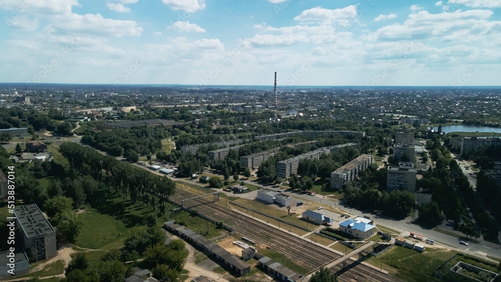 Tranquil suburbs in a big city. Multi-storey buildings and a large green area. Panoramic photo. Aerial photography.