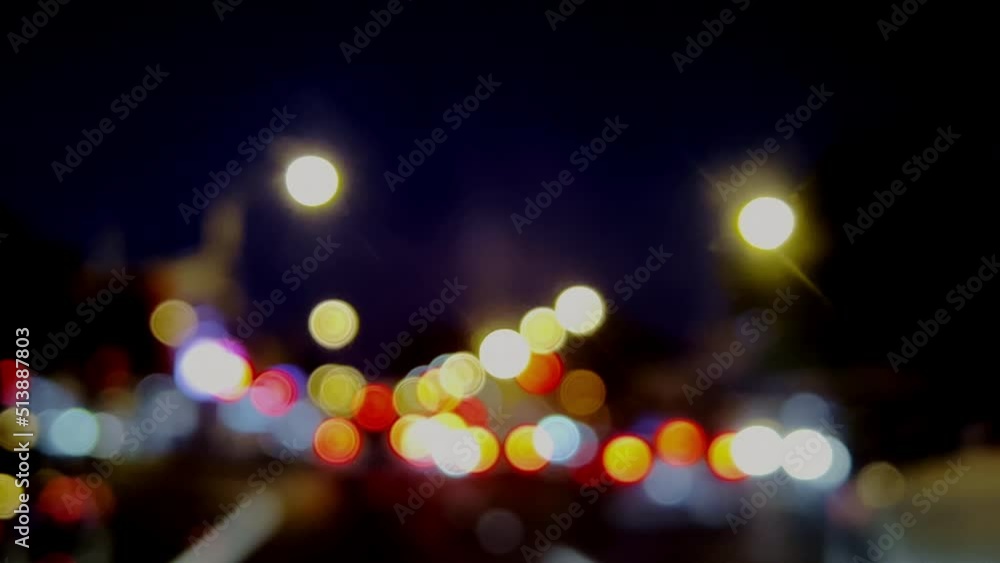 Beautiful sparkling light bokeh night city. Round colorful bokeh shines from heavy traffic from car headlights on a city street. Beautiful sparkling light bokeh night city. Round colorful bokeh shines from heavy traffic from car headlights on a city street.