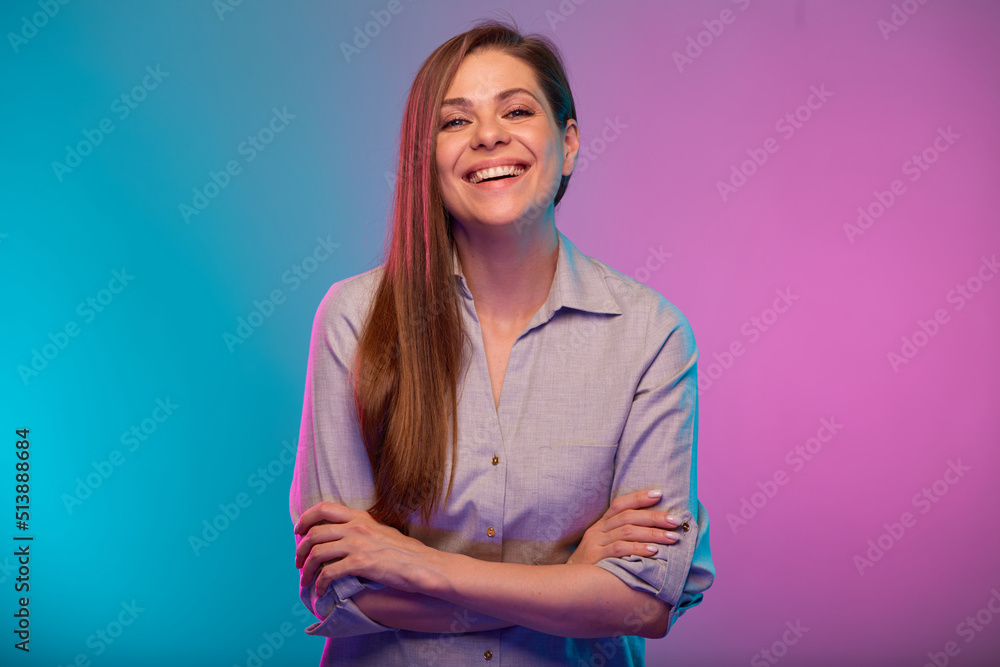 © Yuriy Shevtsov - Smiling woman with arms crossed portrait in neon lights. Businesswoman isolated on neon multicolored background. © Yuriy Shevtsov - Smiling woman with arms crossed portrait in neon lights. Businesswoman isolated on neon multicolored background.