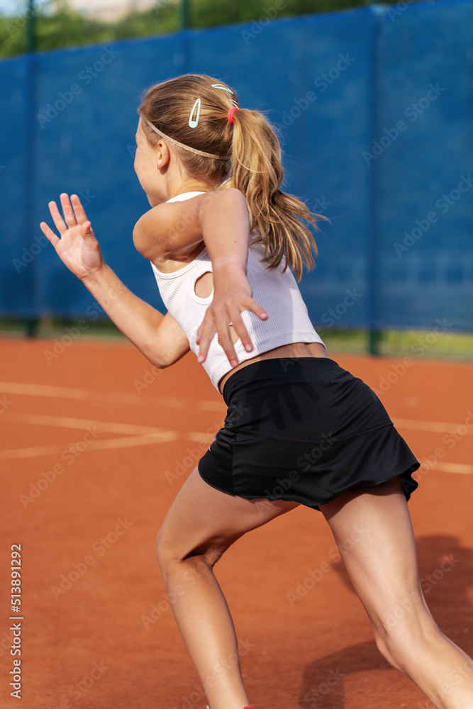 Tennis player warming up on tennis court