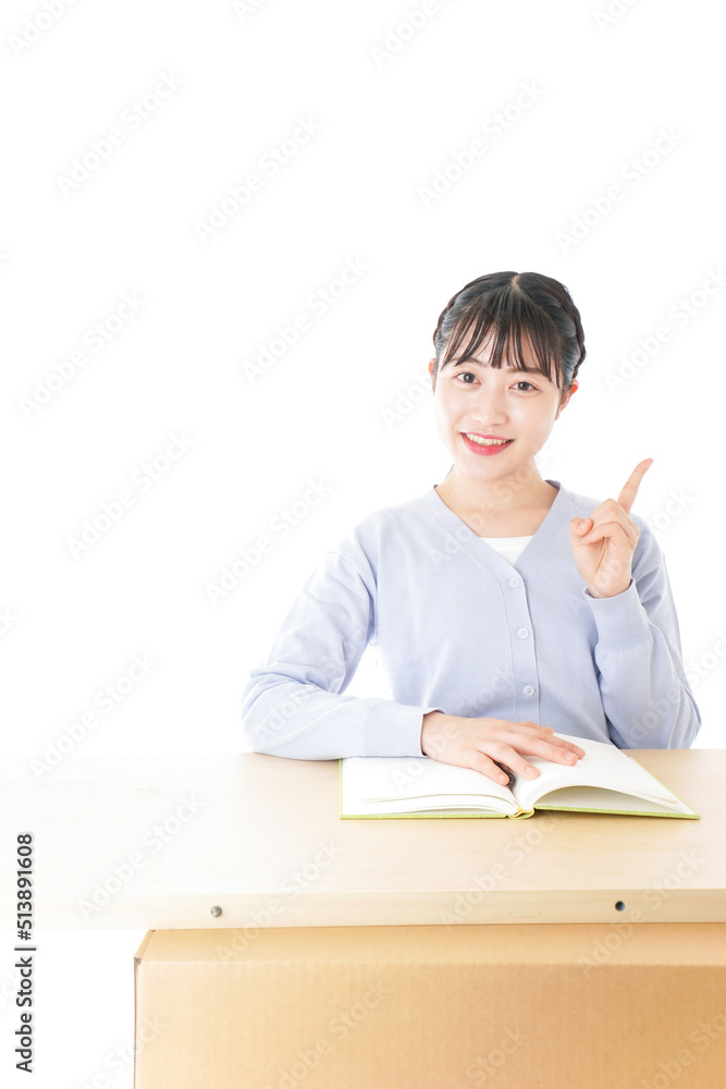 Young student pointing something at school